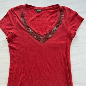 Women’s rust colored, short sleeved, v-neck tee